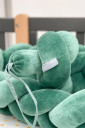 Захисний бортик-косичка в дитяче ліжечко, зеленого кольору